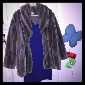 Grey furry coat with skin tight blue v neck dress